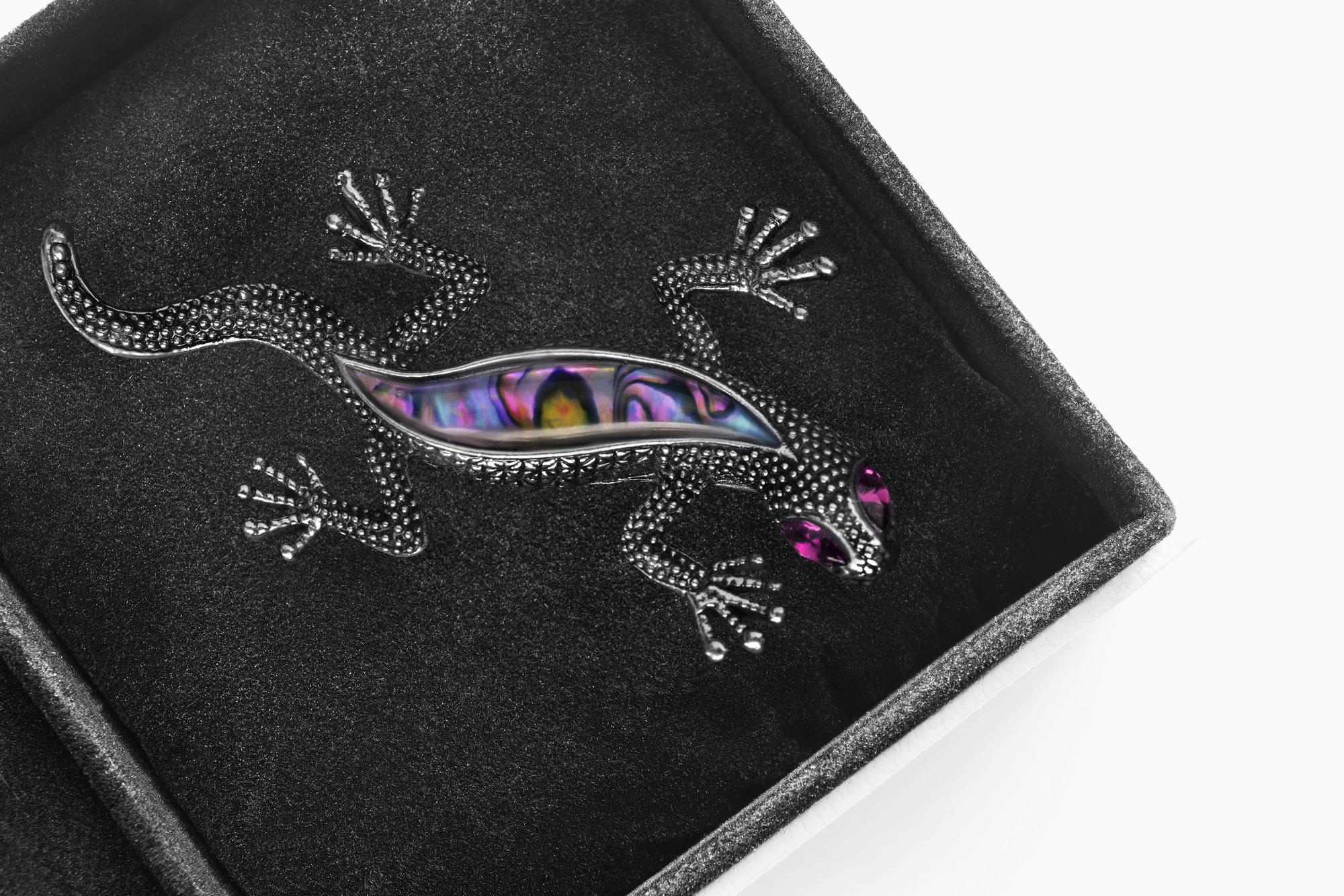 Close-up of futuristic embroidered patch on dark fabric
